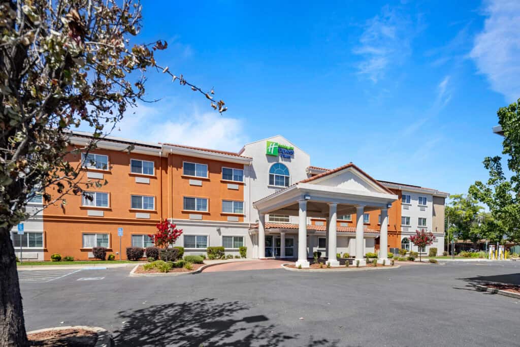 Exterior view of Atlas Hospitality hotel at Holiday Inn Express & Suites Oroville.